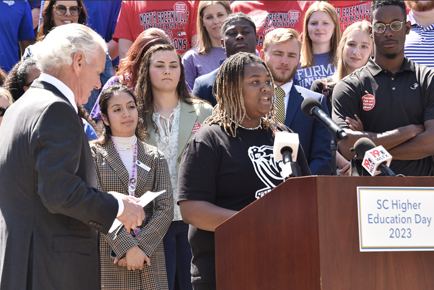 Kylah Montgomery (standing behind podium) shared with Gov. McMaster (left), members of the General Assembly, fellow S.C. higher education students (in audience), and the media the importance of the Tuition Grants program to her education at Benedict College.